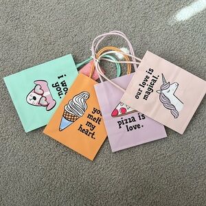 36 gift bags total. 9 sets of 4 mini gift/ party favor bags